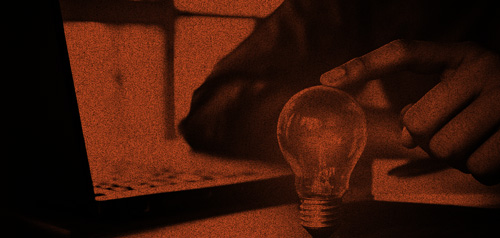 Hand holding light bulb -