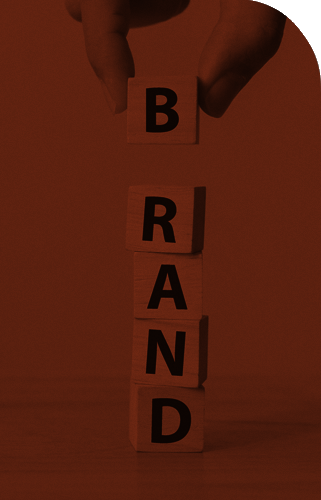 Blocks spelling out Brand with hand holding B Block