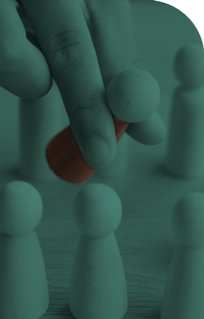 hand picking up red wood person from group of blank wood persons