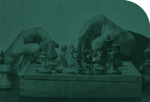 business people playing chess at the same time