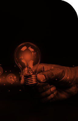 Hand holding a Lightbulb with thoughts coming out