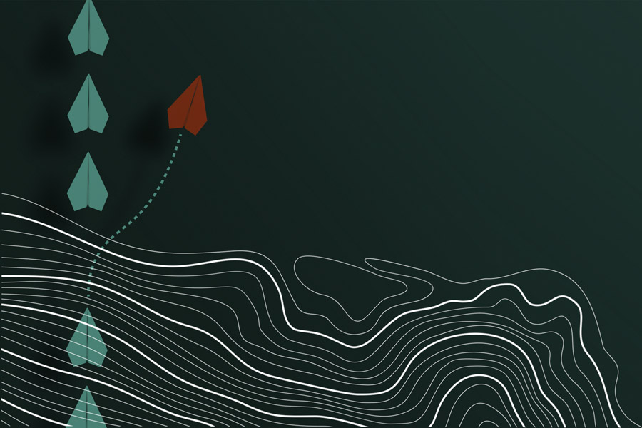 Concept of Individuality: white paper plans with one red plan leaving path