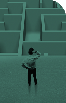 business man looking at challenging maze
